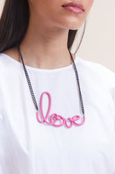 Pink leather women's short with distinctive love-link metal necklace